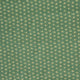 A close-up of a green fabric or wallpaper pattern featuring a repeating small floral motif in pale yellow and off-white.