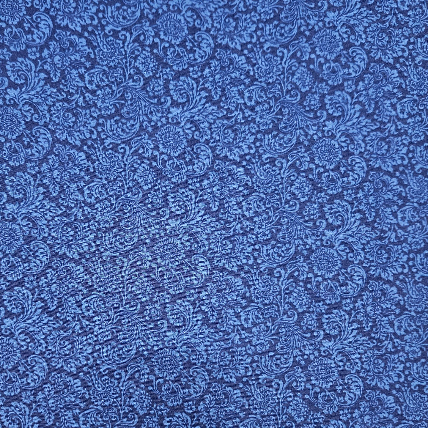 Blue floral pattern on a blue background