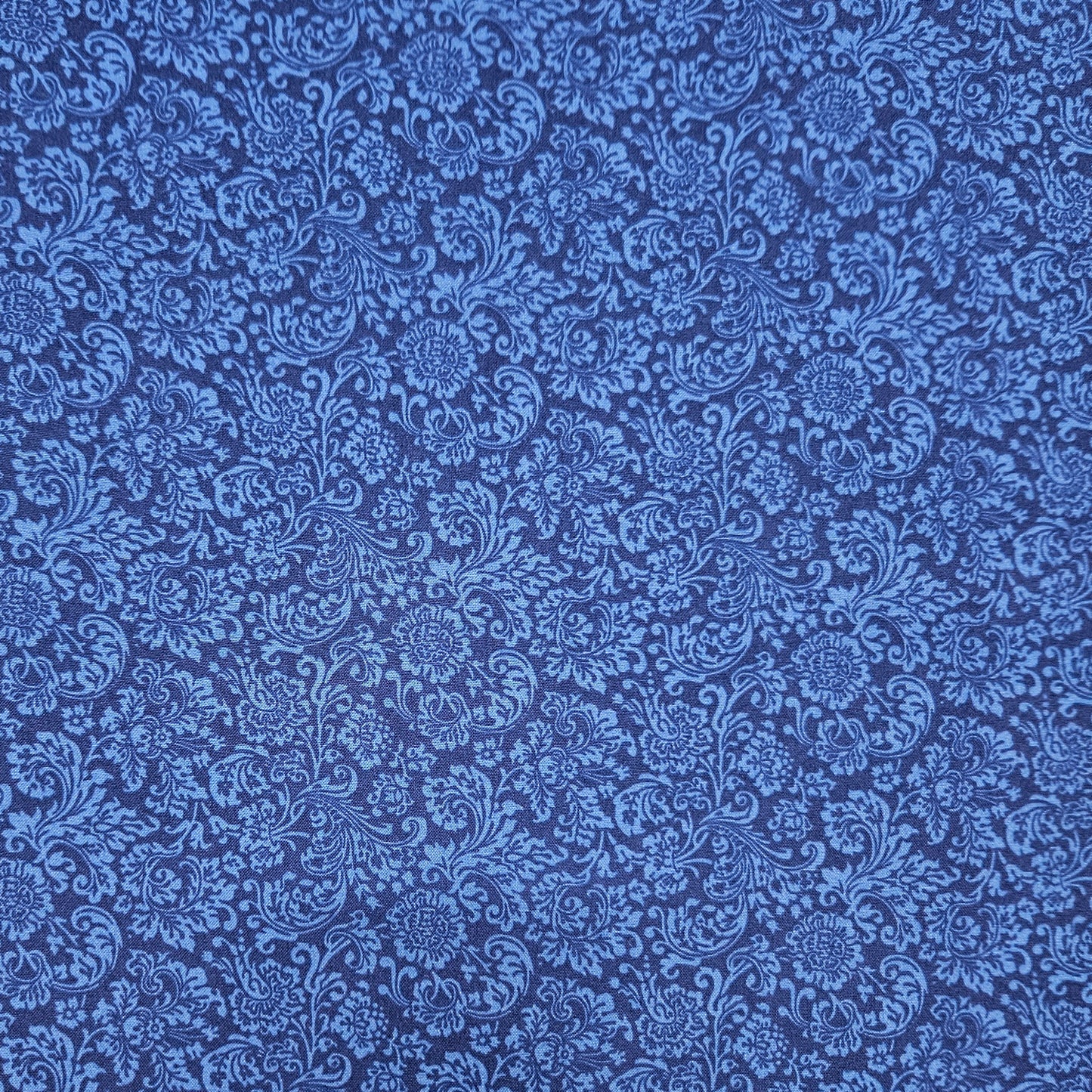 Blue floral pattern on a blue background