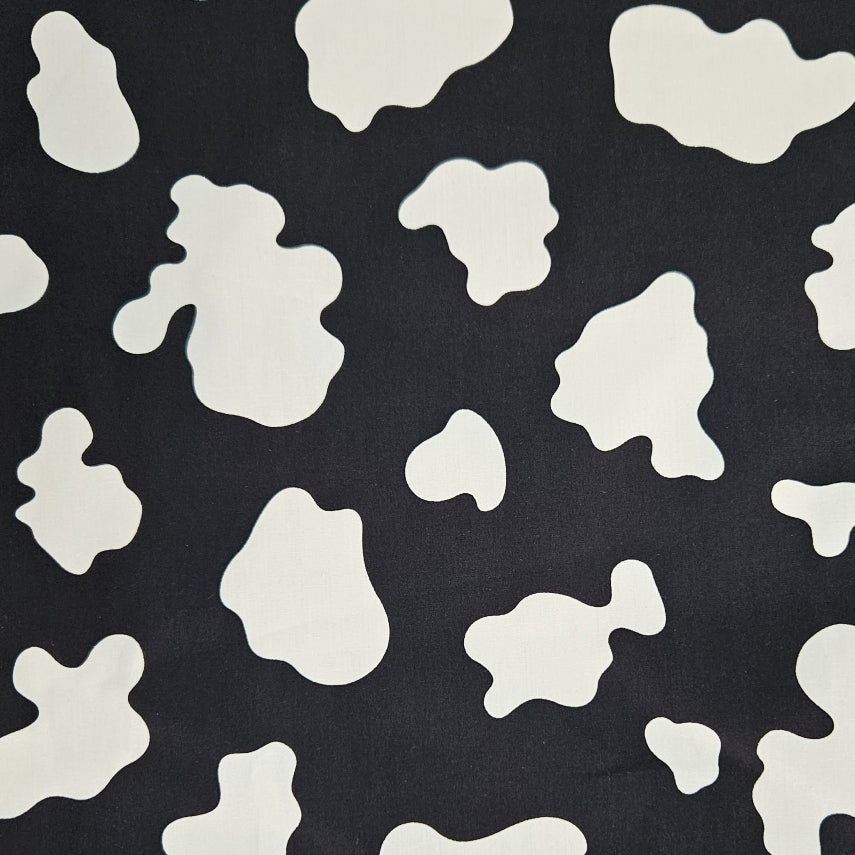 Black fabric with white abstract shapes pattern