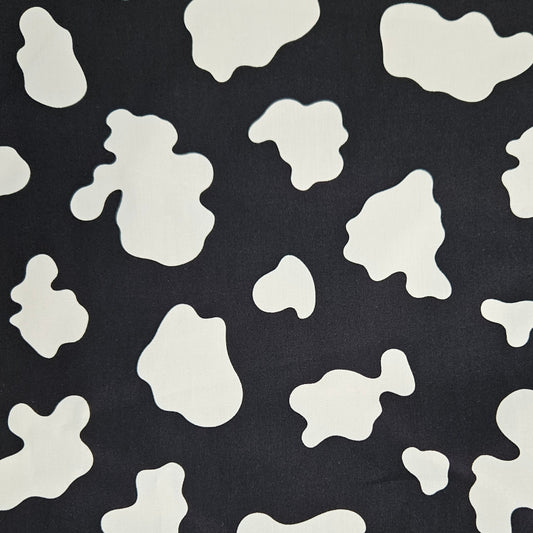 Black fabric with white abstract shapes pattern
