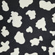 Black fabric with white abstract shapes pattern