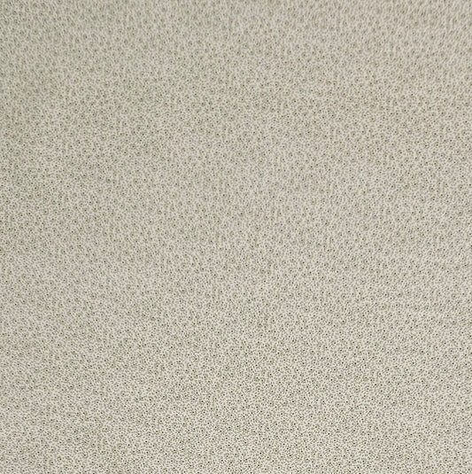 A close-up of a textured fabric or wallpaper pattern featuring a dense, small-scale floral or ditsy print in muted beige and gray tones.
