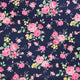 Floral pattern with pink roses and yellow flowers on a dark blue background