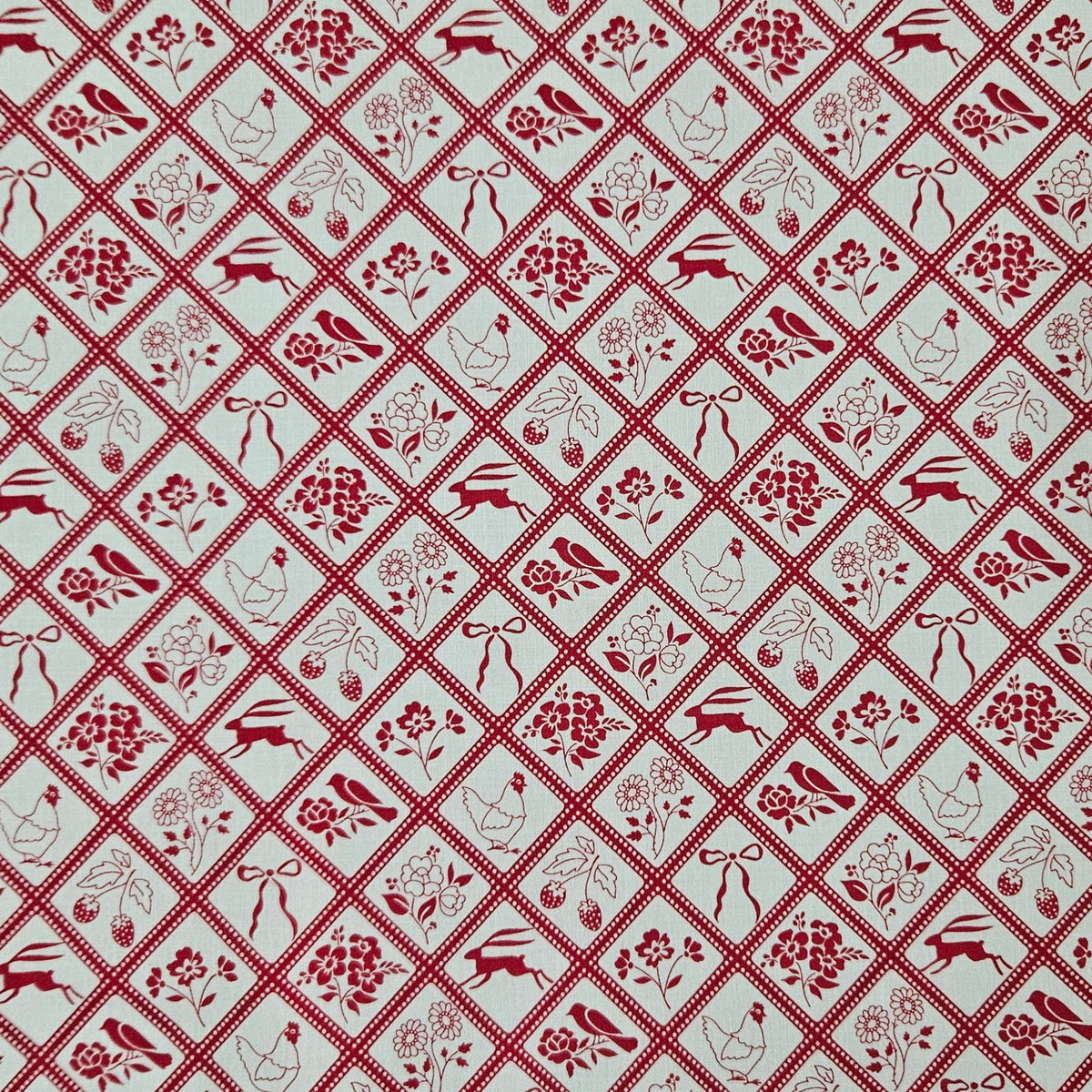 A repeating red and white geometric pattern featuring diamond-shaped tiles with floral motifs, ribbons, and small decorative illustrations.