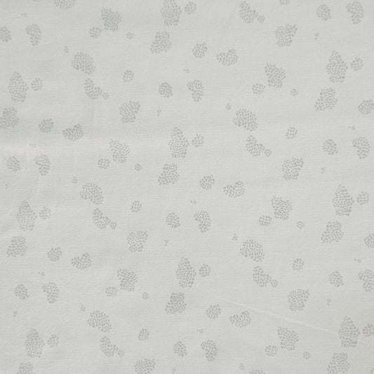 A close-up of a light gray fabric with a repeating pattern of small gray leaf or pinecone-like motifs.