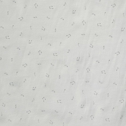 White fabric with a delicate pattern of small gray musical notes and quarter rests.